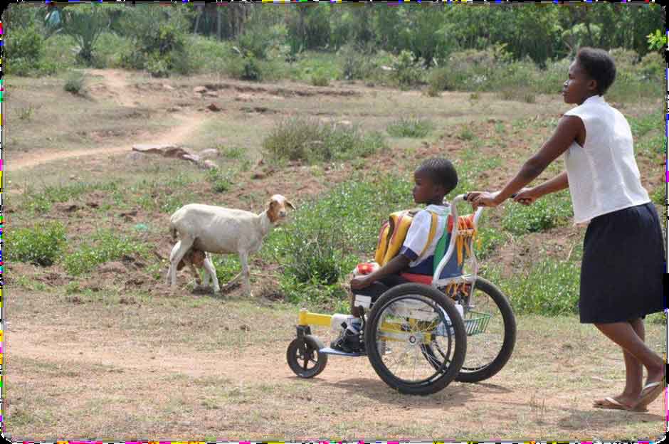 Child in wheelchair on way to school